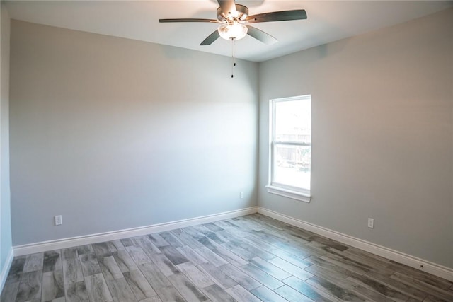 spare room featuring ceiling fan and hardwood / wood-style floors