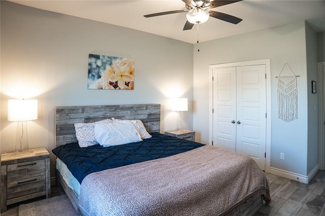 bedroom featuring ceiling fan, a closet, and wood-type flooring