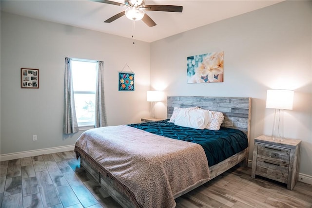 bedroom featuring ceiling fan and hardwood / wood-style floors