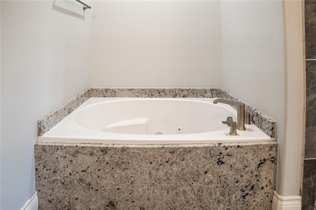 bathroom with tiled bath