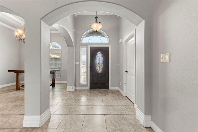 entrance foyer featuring a chandelier