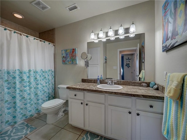 bathroom with a shower with shower curtain, vanity, toilet, and tile patterned flooring