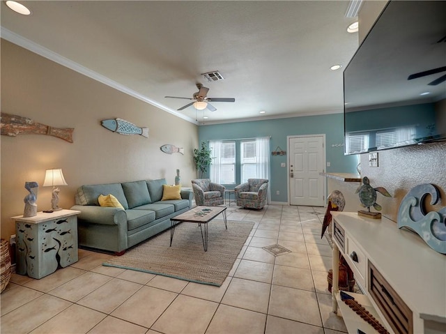 tiled living room with ornamental molding and ceiling fan