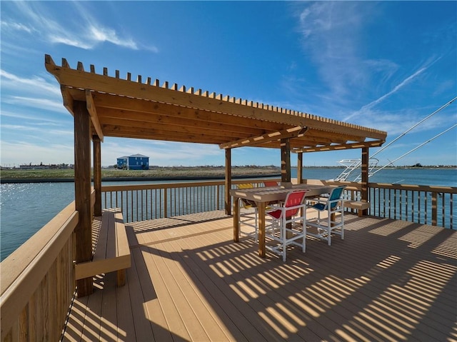 view of dock with a deck with water view and a pergola