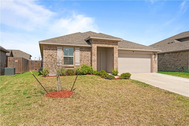 view of front of home featuring a garage, brick siding, driveway, and a front lawn