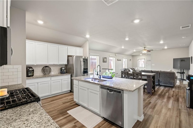7706 Iron Man, Corpus Christi, TX 78414 - kitchen featuring stainless steel appliances, wood finished floors, a sink, visible vents, and open floor plan