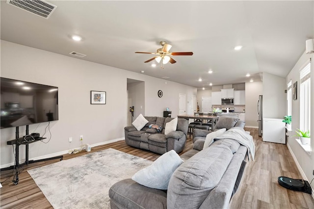 7706 Iron Man, Corpus Christi, TX 78414 - living room featuring light wood finished floors, visible vents, and recessed lighting