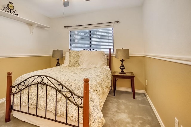 carpeted bedroom featuring a ceiling fan and baseboards