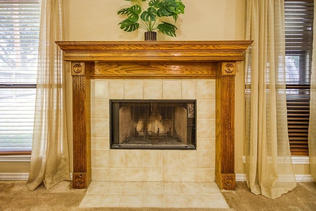 interior details with a tiled fireplace