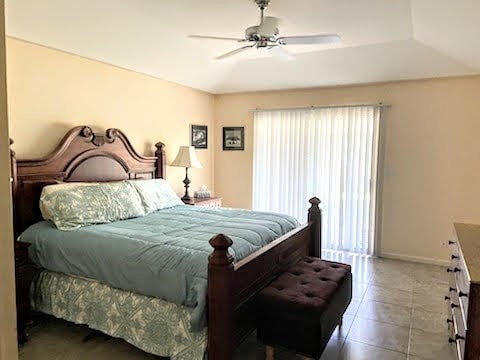 bedroom featuring tile patterned flooring and ceiling fan