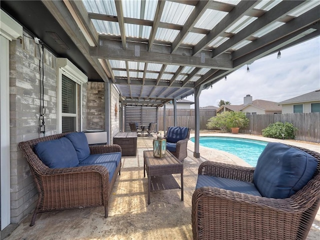 view of pool with outdoor lounge area, a fenced backyard, and a patio