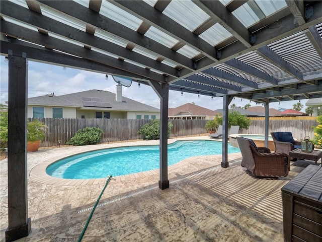 view of swimming pool with a pergola, a fenced backyard, and a patio area