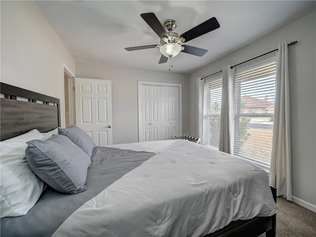 bedroom with carpet floors and a ceiling fan