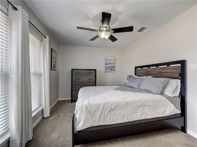 bedroom featuring carpet, baseboards, and a ceiling fan