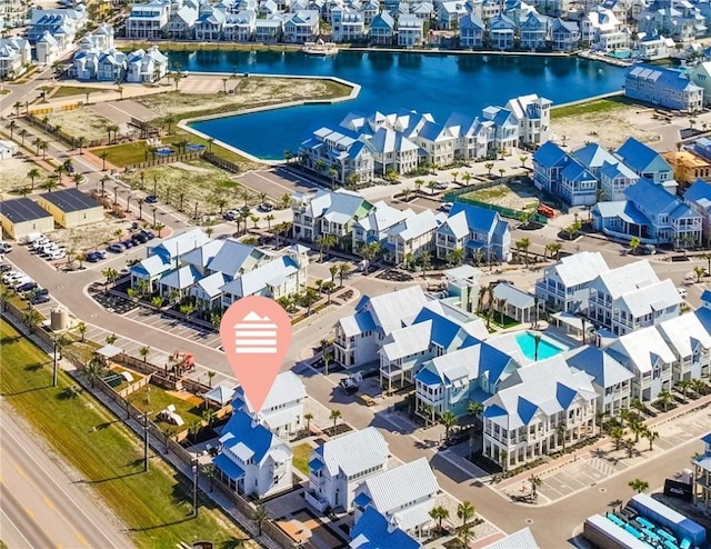 aerial view featuring a residential view and a water view