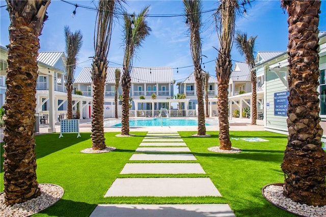 view of yard featuring a community pool