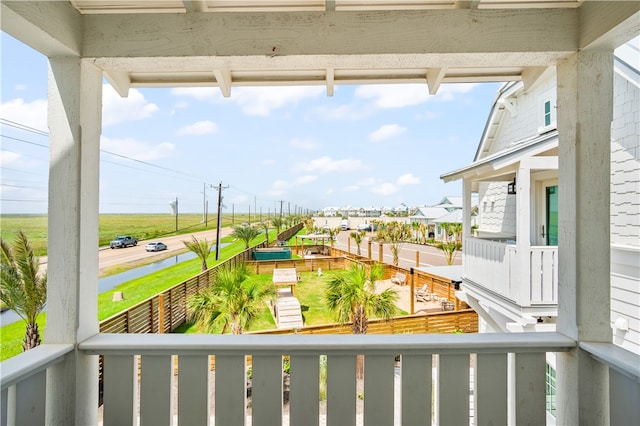 balcony featuring a water view