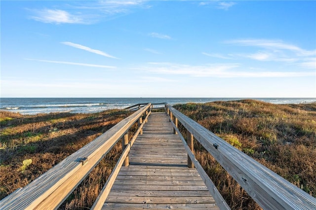 view of property's community featuring a view of the beach and a water view