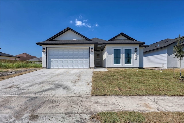 single story home with a garage and a front yard