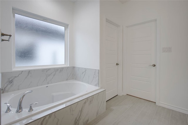 bathroom with tiled bath