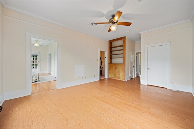 spare room featuring ceiling fan, light hardwood / wood-style flooring, and ornamental molding