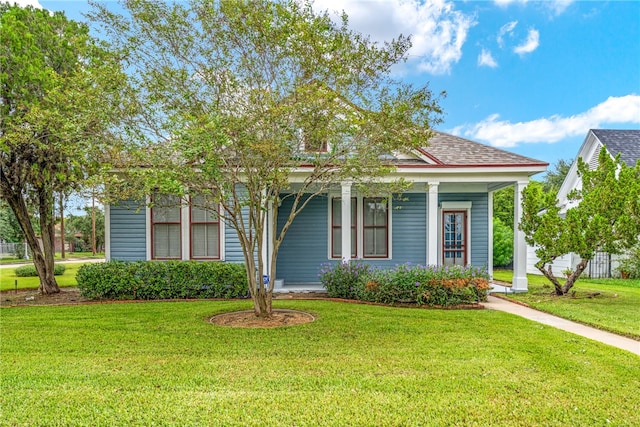 view of front of property featuring a porch and a front lawn