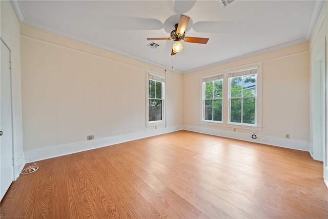 spare room with ceiling fan, ornamental molding, and light hardwood / wood-style flooring