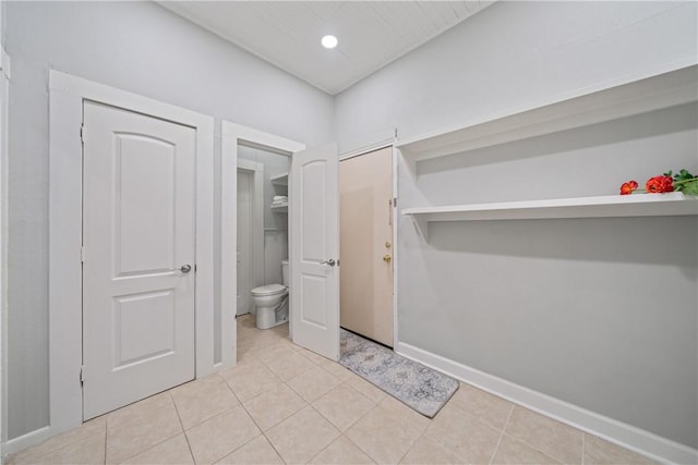 bathroom featuring toilet and tile patterned floors