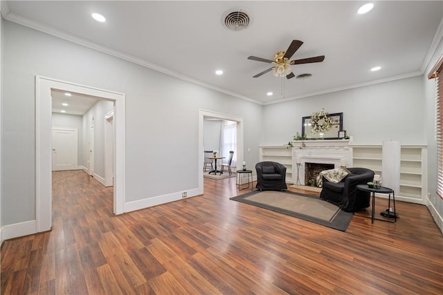 unfurnished room with ceiling fan, dark wood-type flooring, and ornamental molding