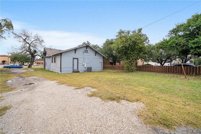 view of property exterior with a yard