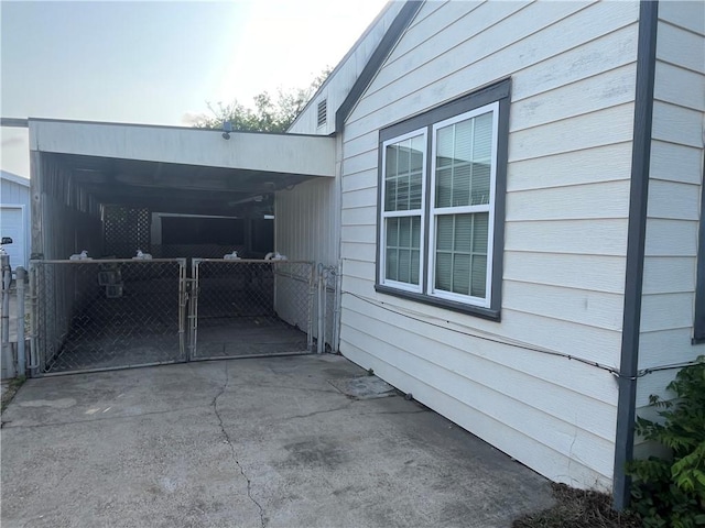 view of property exterior with a gate and fence
