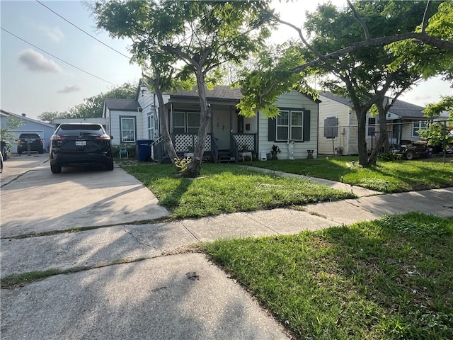 bungalow-style house with a front lawn