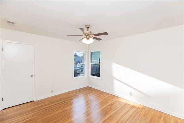 unfurnished room with ceiling fan and light wood-type flooring