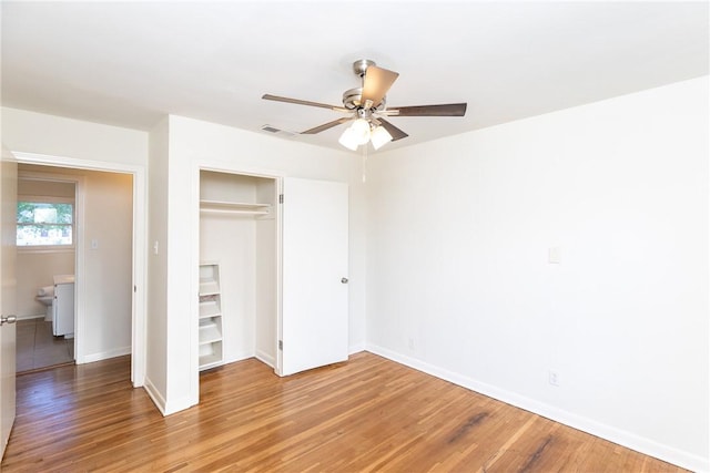 unfurnished bedroom featuring a closet, ceiling fan, and hardwood / wood-style floors