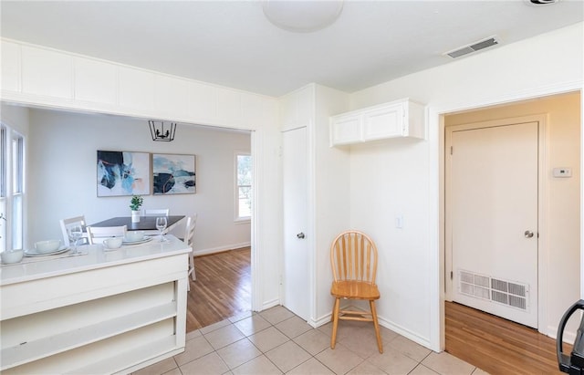 kitchen with white cabinetry and light tile patterned floors