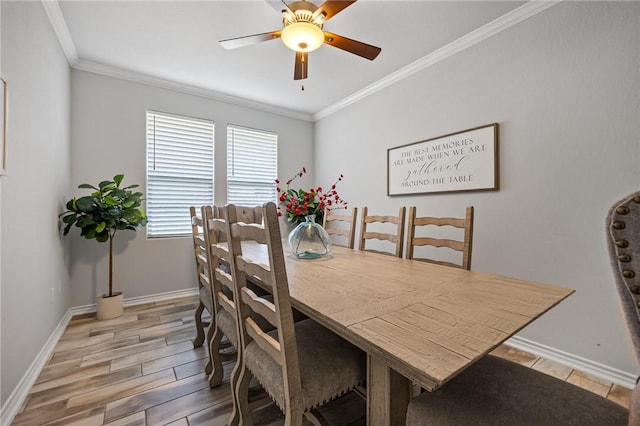 dining area featuring baseboards, ornamental molding, and light wood-style flooring