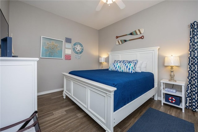 bedroom with ceiling fan, baseboards, and wood finished floors