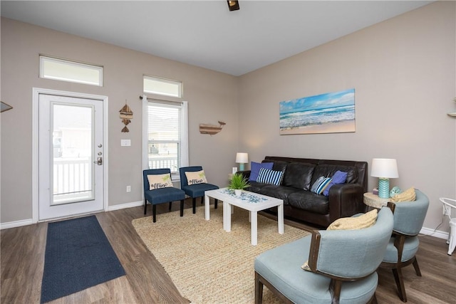 living room featuring baseboards and wood finished floors