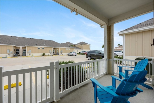 balcony featuring a residential view and covered porch