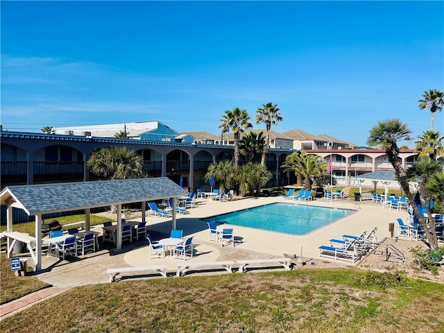 view of swimming pool featuring a patio area