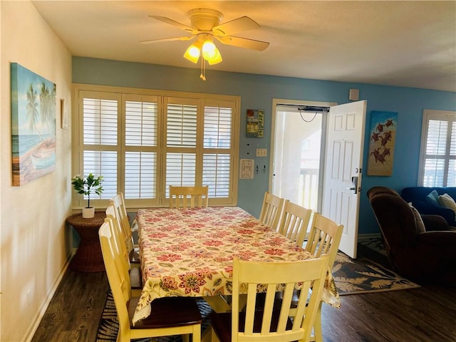 dining room with dark hardwood / wood-style flooring, plenty of natural light, and ceiling fan