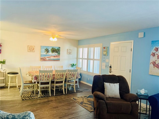 dining area featuring dark hardwood / wood-style floors and ceiling fan