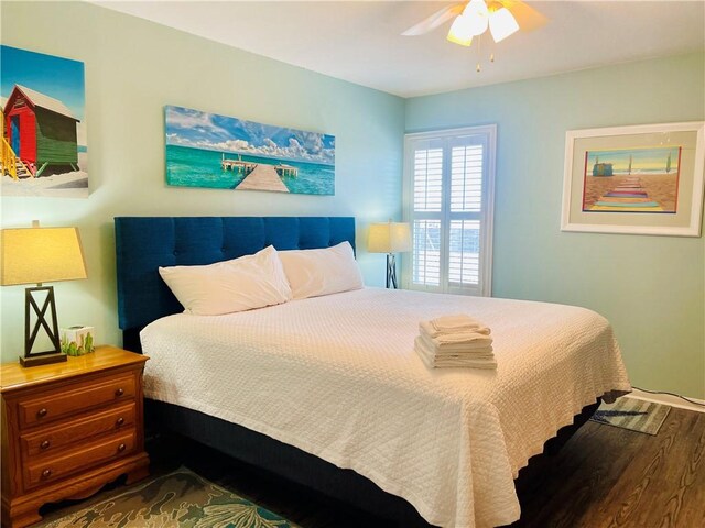 bedroom featuring ceiling fan and hardwood / wood-style flooring