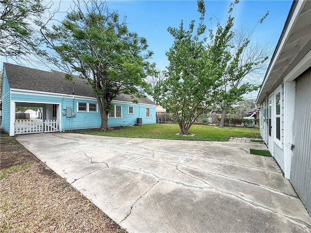 1245 Florida Ave, Corpus Christi, TX 78404 - view of patio / terrace with driveway, a carport, and fence