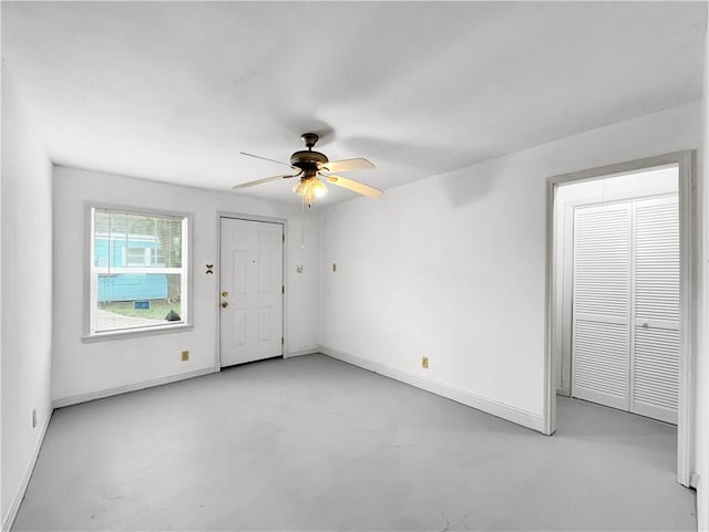 1245 Florida Ave, Corpus Christi, TX 78404 - unfurnished room with finished concrete flooring, baseboards, and a ceiling fan