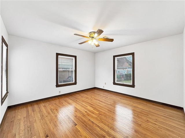 1245 Florida Ave, Corpus Christi, TX 78404 - unfurnished room featuring baseboards, light wood-style floors, and a ceiling fan