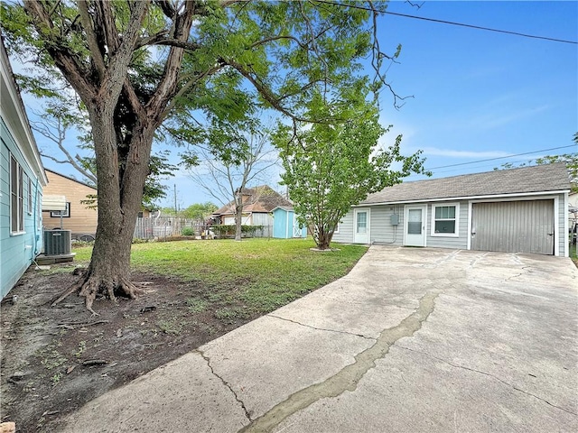 1245 Florida Ave, Corpus Christi, TX 78404 - view of yard with central air condition unit, concrete driveway, and fence
