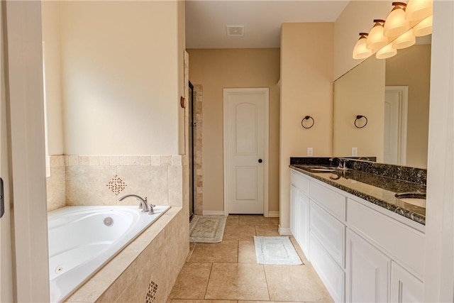 bathroom featuring separate shower and tub, tile patterned flooring, and vanity