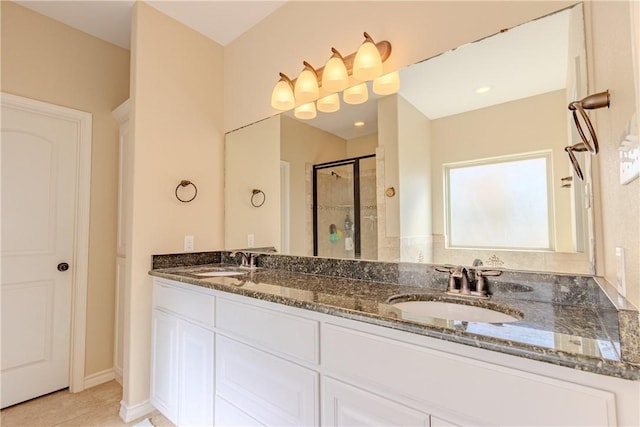 bathroom featuring tile patterned flooring, vanity, and an enclosed shower