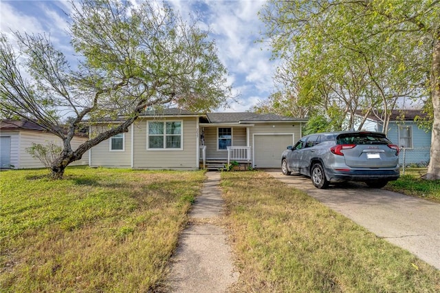 view of front facade with a garage and a front lawn